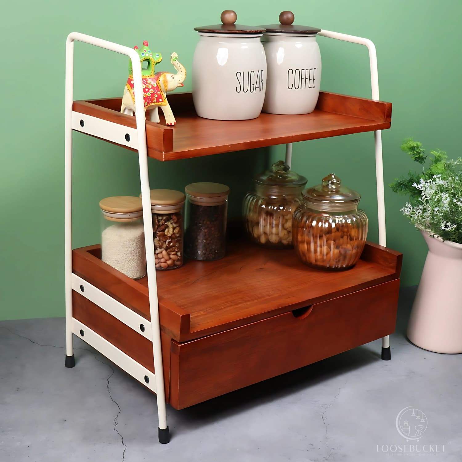 Loosebucket Kitcaddy Premium Wooden Kitchen Organizer featuring two-tier walnut-finished acacia wood shelves with ivory metal frame, displaying storage jar of Coffee and tea and canisters . Modern industrial design with rustic appeal.