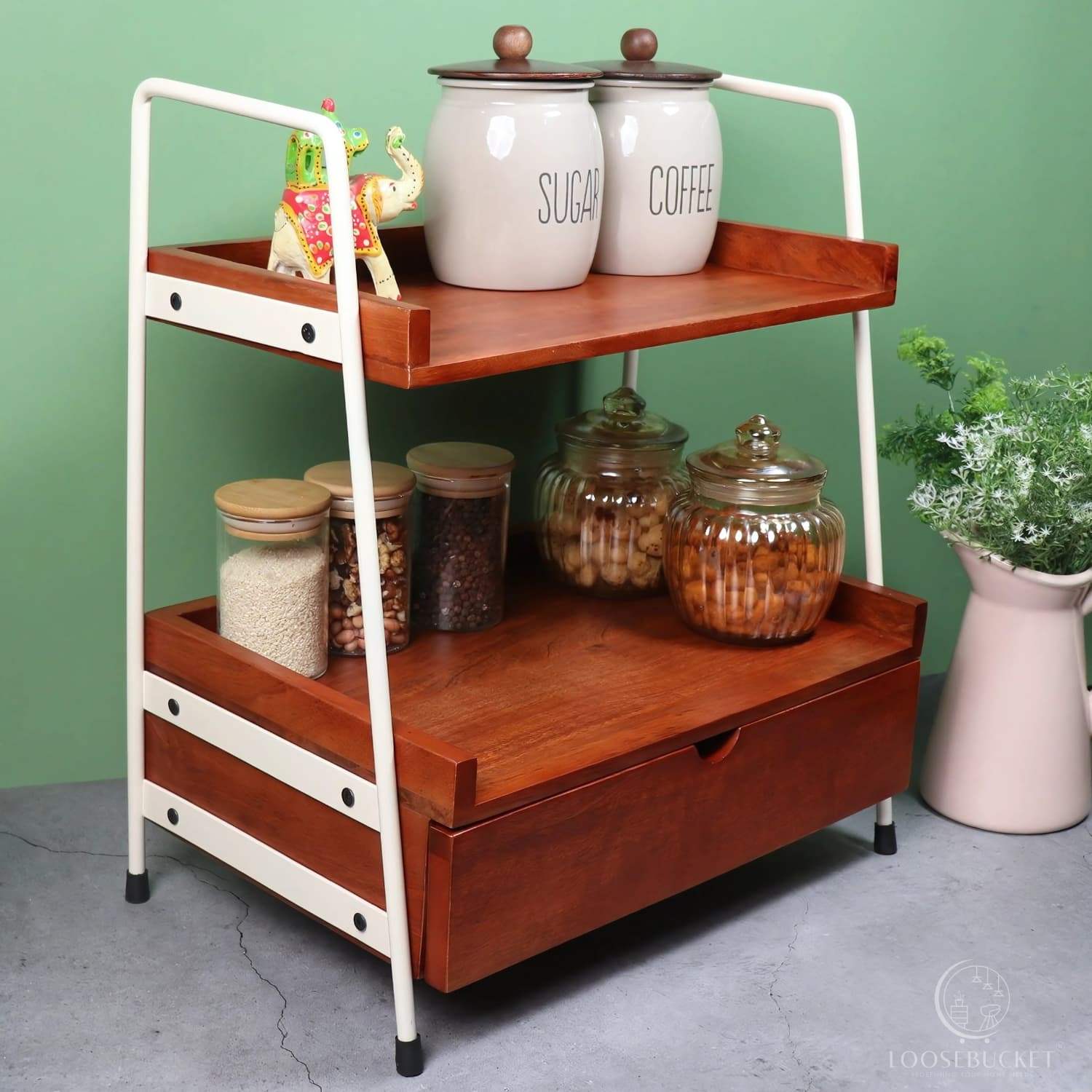 Loosebucket Kitcaddy Premium Wooden Kitchen Organizer featuring two-tier walnut-finished acacia wood shelves with ivory metal frame, displaying storage jar of Coffee and tea and canisters . Modern industrial design with rustic appeal.