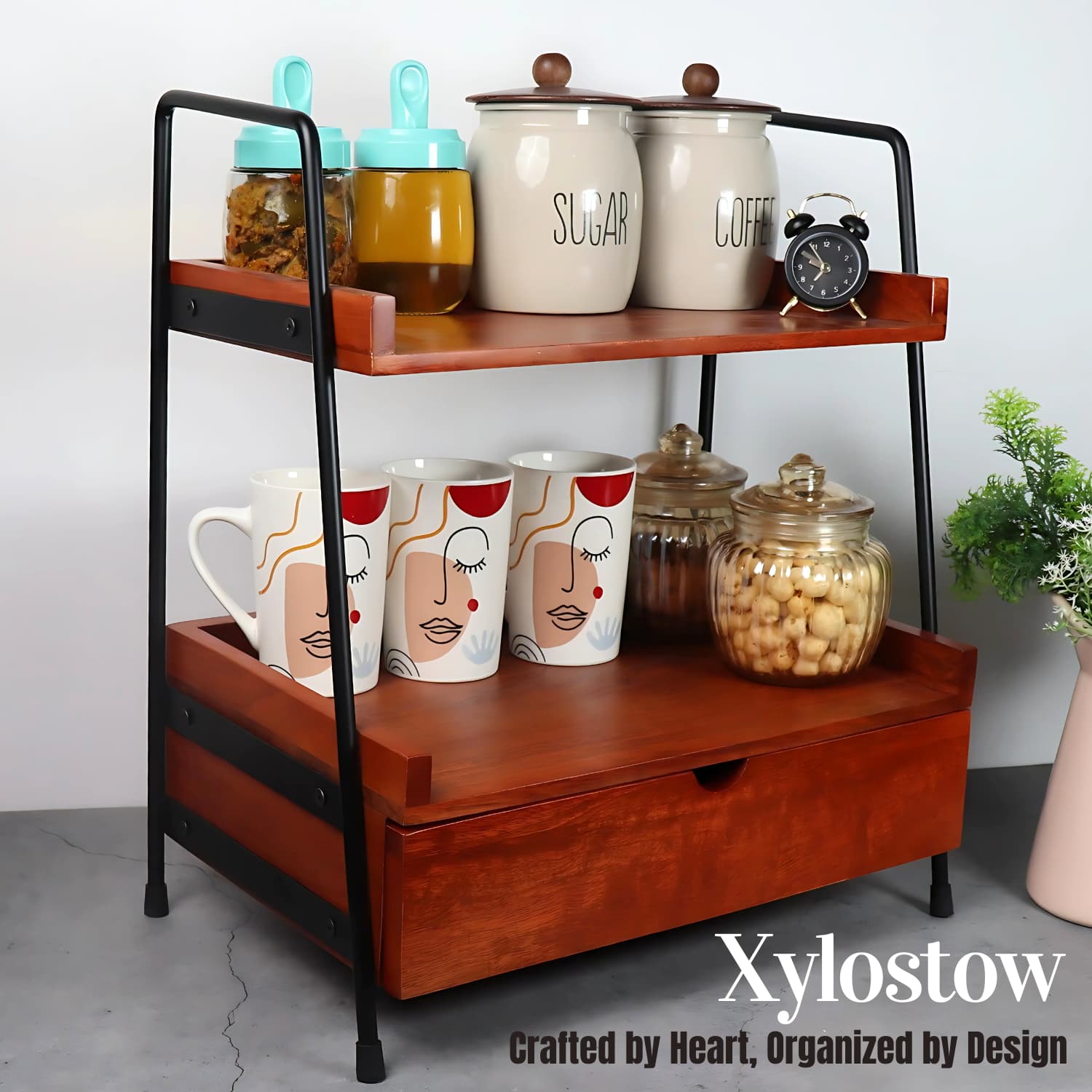 Loosebucket's Xylostow Premium Woden kitchen organizer displaying kitchen jar ,coffee mug and small table watch on it