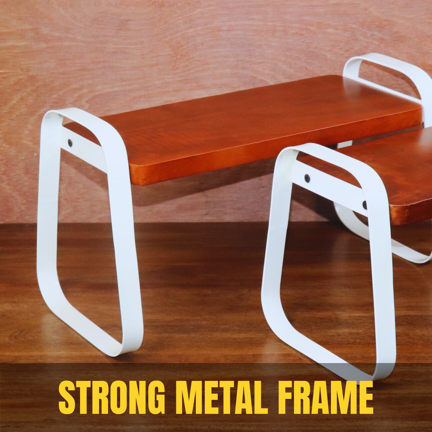 A wooden bench with white metal legs featuring a strong, minimalist design. The caption "STRONG METAL FRAME" is written prominently in yellow on a brown background. Discover the best premium kitchen organizer to complement this style—buy India's top choice online today! Introducing The Stackable Wooden Kitchen Organizer Set of 2 by LOOSEBUCKET.