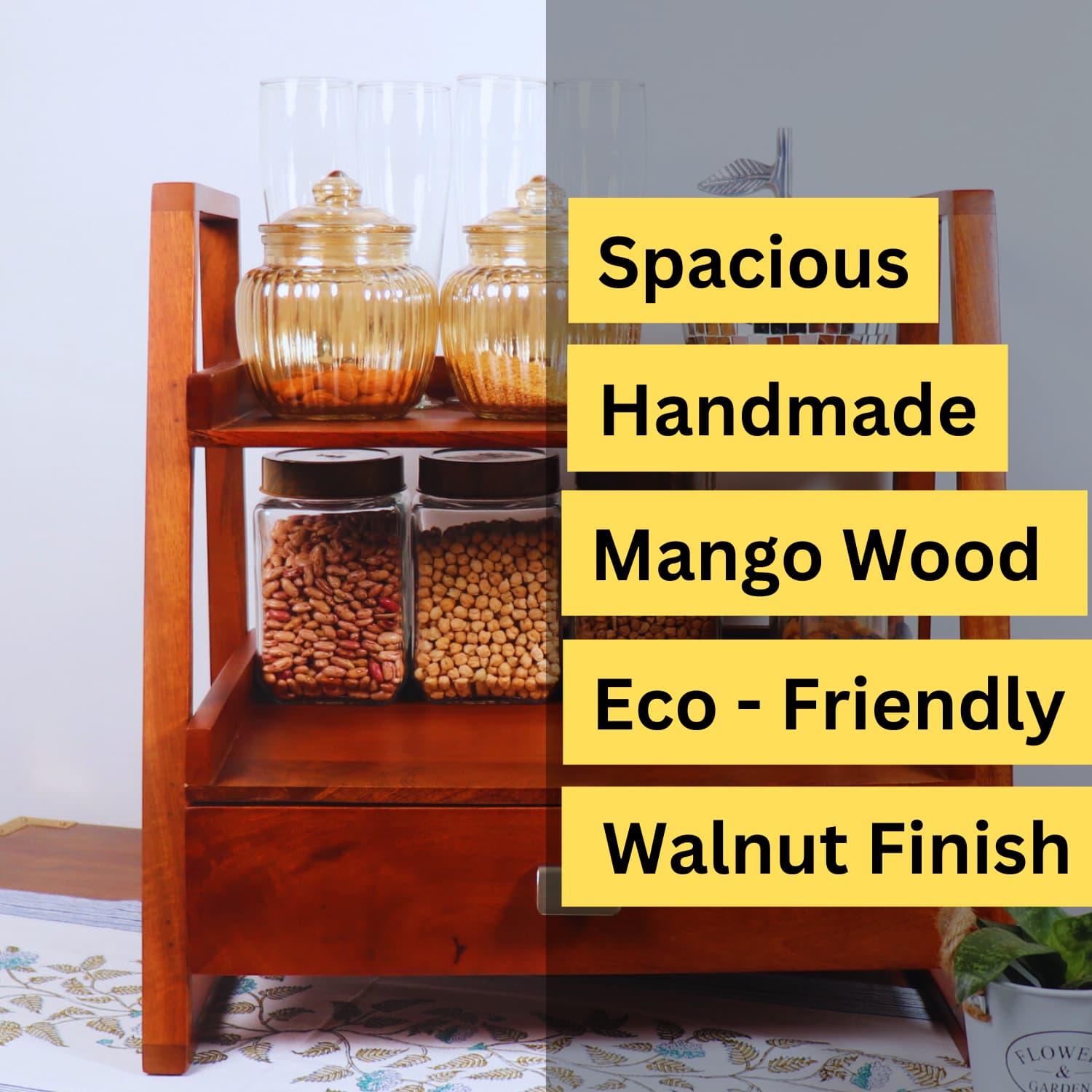 A two-tier handmade kitchen storage rack made from mango wood with a walnut finish. The top tier holds two glass jars with ribbed gold-tone lids, while the bottom tier has two square glass containers filled with nuts. Overlay text reads: Spacious, Handmade, Mango Wood, Eco-Friendly, Walnut Finish. Product Name: The Terra Manilla Wooden Kitchen Versatile Organizer by LOOSEBUCKET.